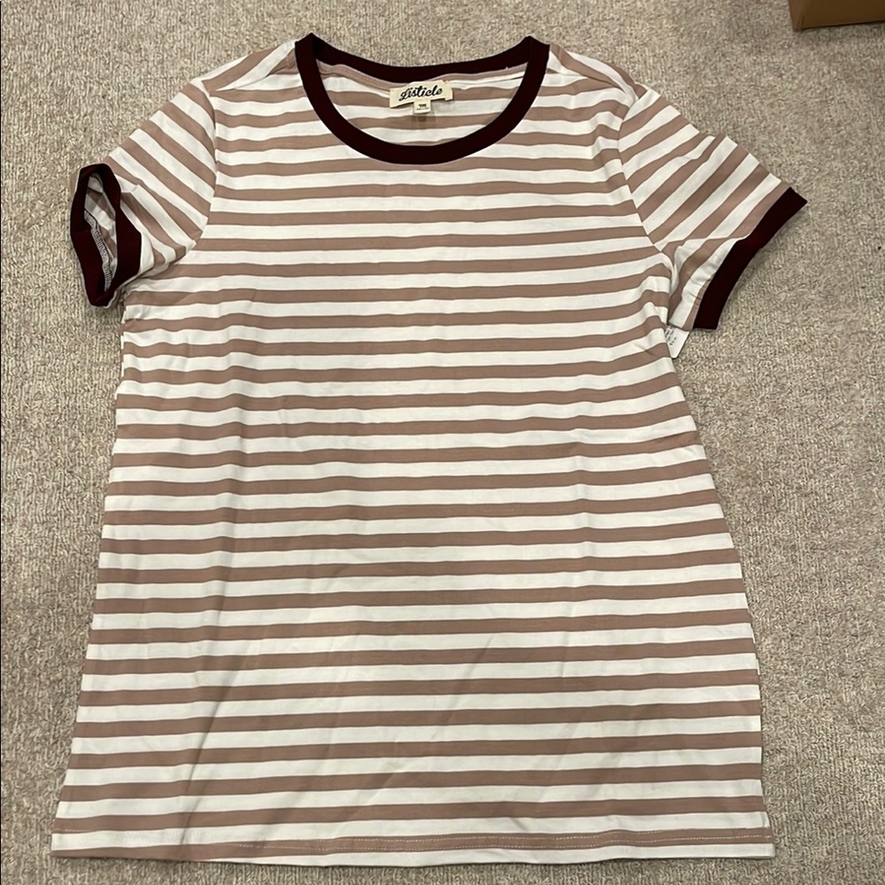 Women’s size medium short sleeve t-shirt.  New with tags.